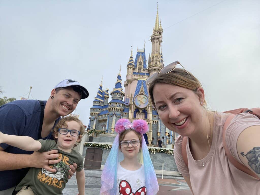 our family in front of Cinderella's castle